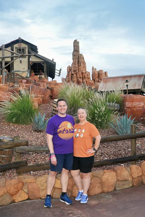 Michelle and her husband in front of Big Thunder Mountain Railroad in Magic Kingdom